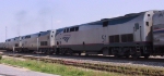 AMTK 46, 11, & 51 lead a train away from Pomona Station